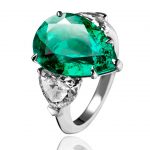 Adler-Ring-in-18kt-white-gold-set-with-one-pear-shaped-Colombian-emerald-6.84-cts,-heart-shaped-diamonds--2.43-cts