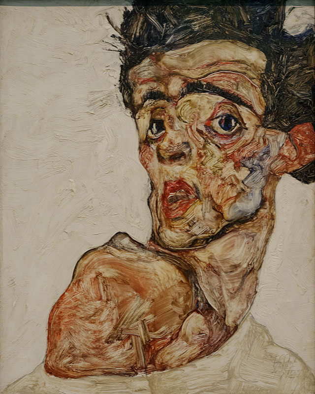 Self_portrait_with_raised_bare_shoulder_Egon_Schiele_1912