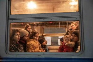 Families with children inside the train to Przemyśl in Poland.